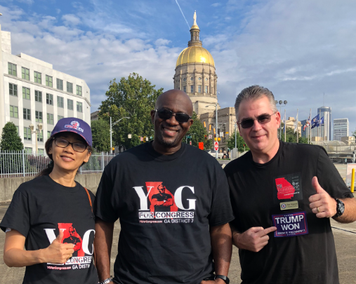 Stan Fitzgerald with Theresa Shen and YG Nyghtstorm at an election-related protest at the Georgia State Capitol in Atlanta on September 18, 2021. Title: